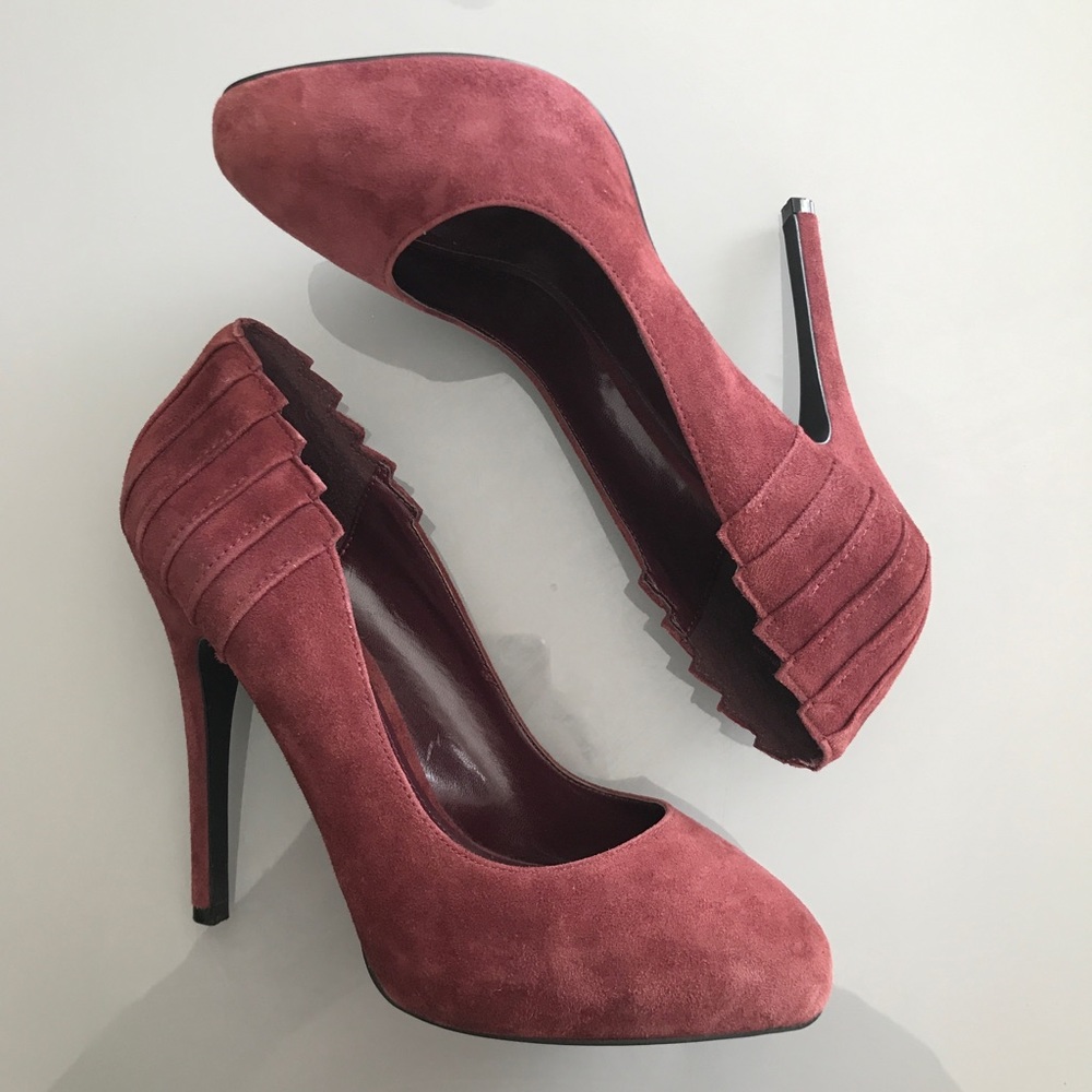 Tall red suede pumps